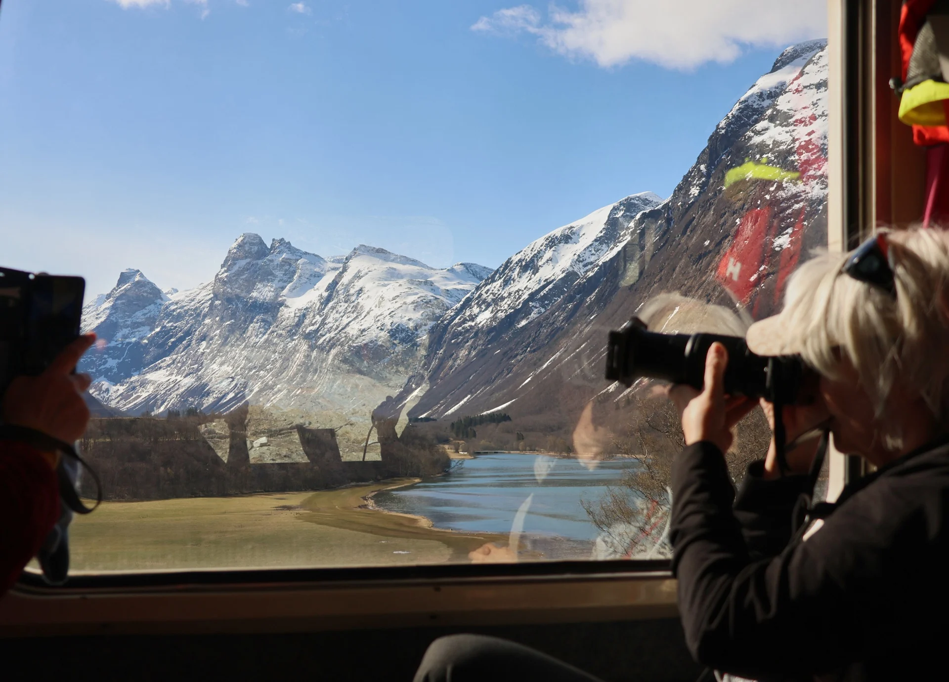 train-passengers-photographing-romsdalen-valley-andalsnes-norway-1920