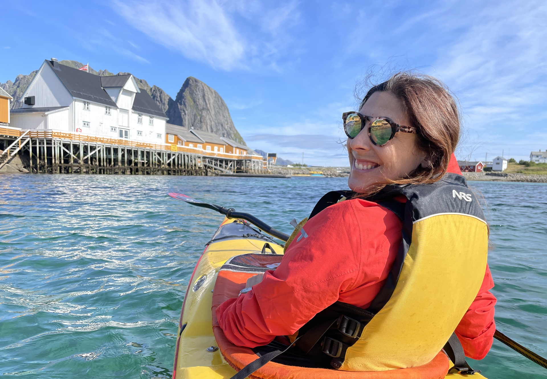 person-yellow-kayak-house-waiter-blue-sky