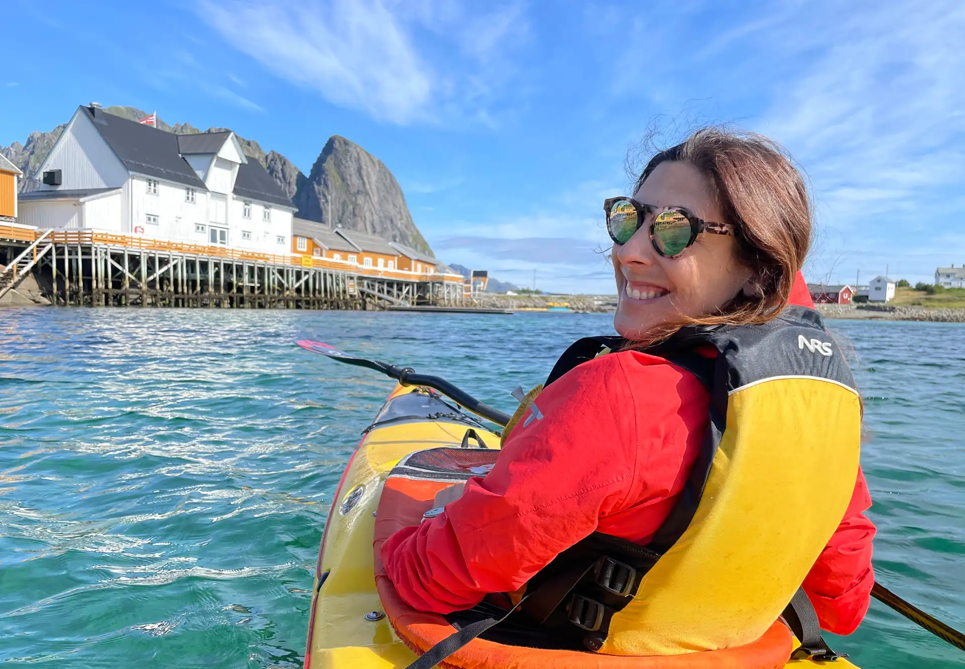 person-yellow-kayak-house-waiter-blue-sky