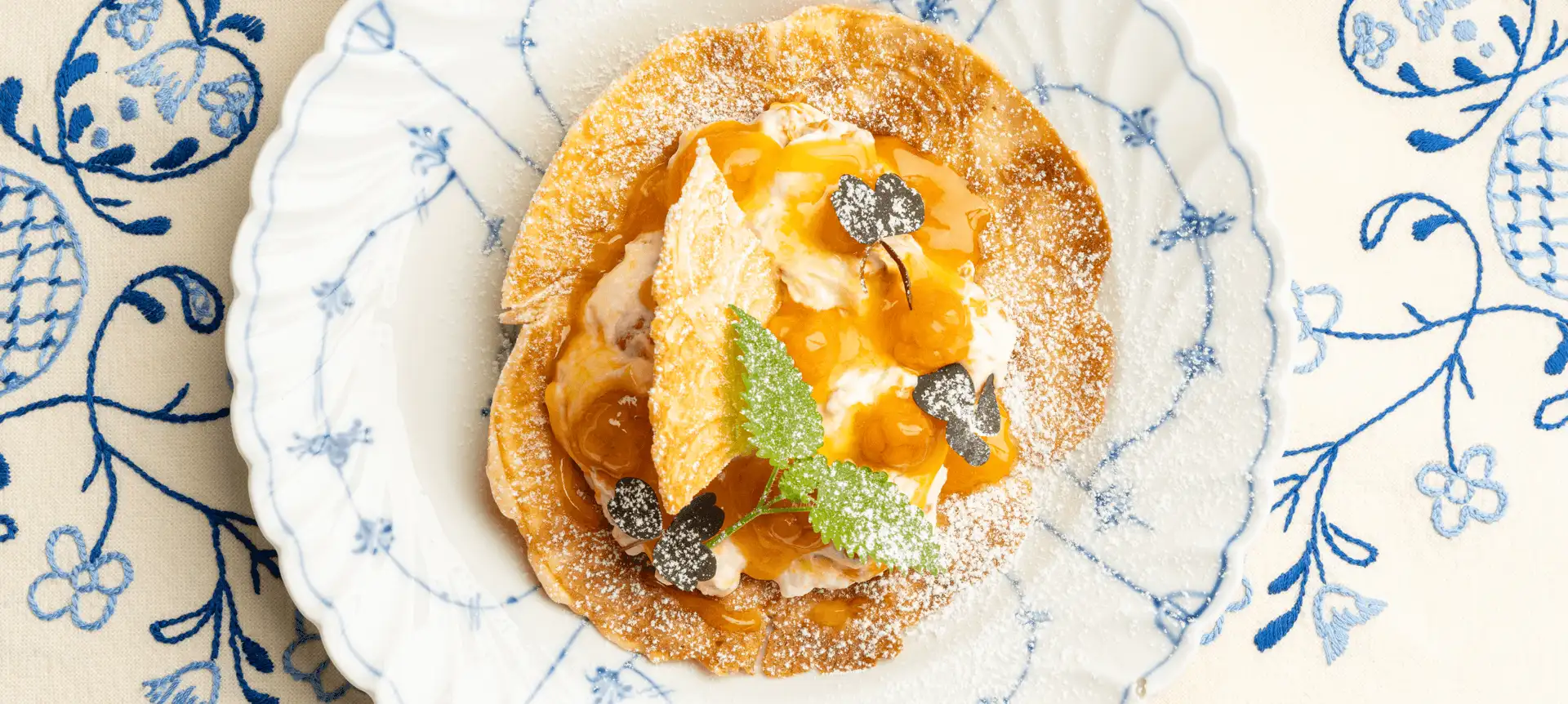 Multekrem (cloudberry cream) served on krumkake. Image copyright: Maverix Media - Visit Norway