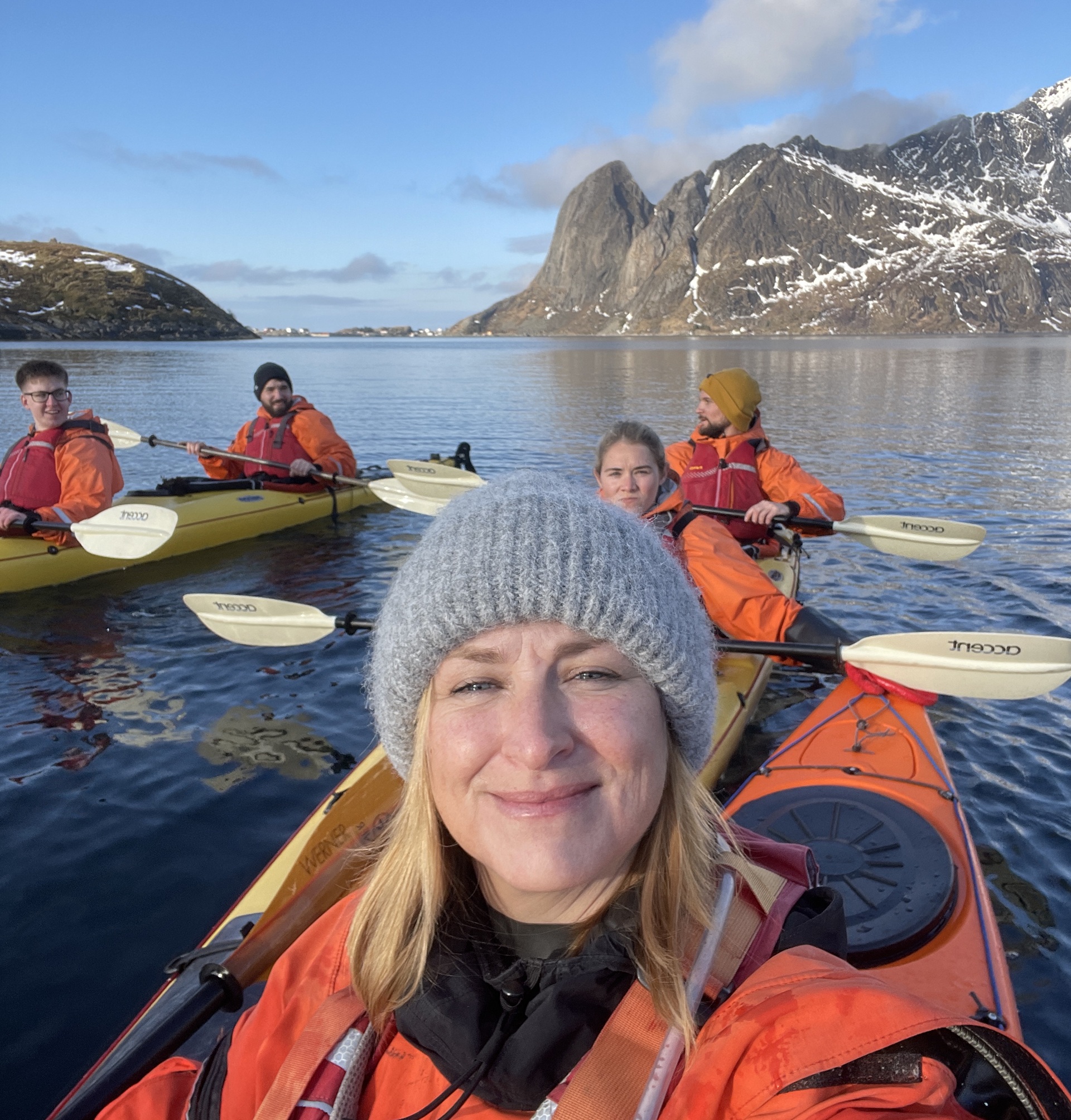 group-people-kayaks-fjords-blue-sky-close-up