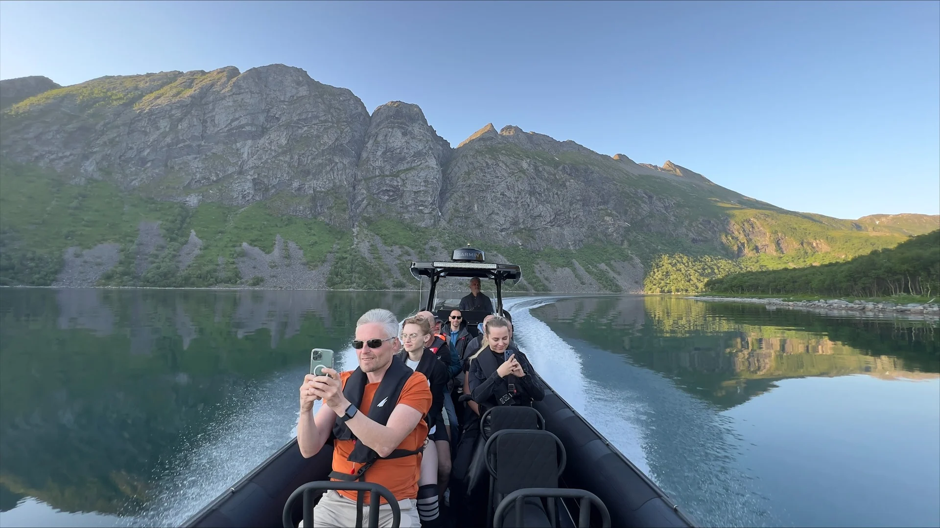 people-phones-rib-boat-fjord-senja-norway