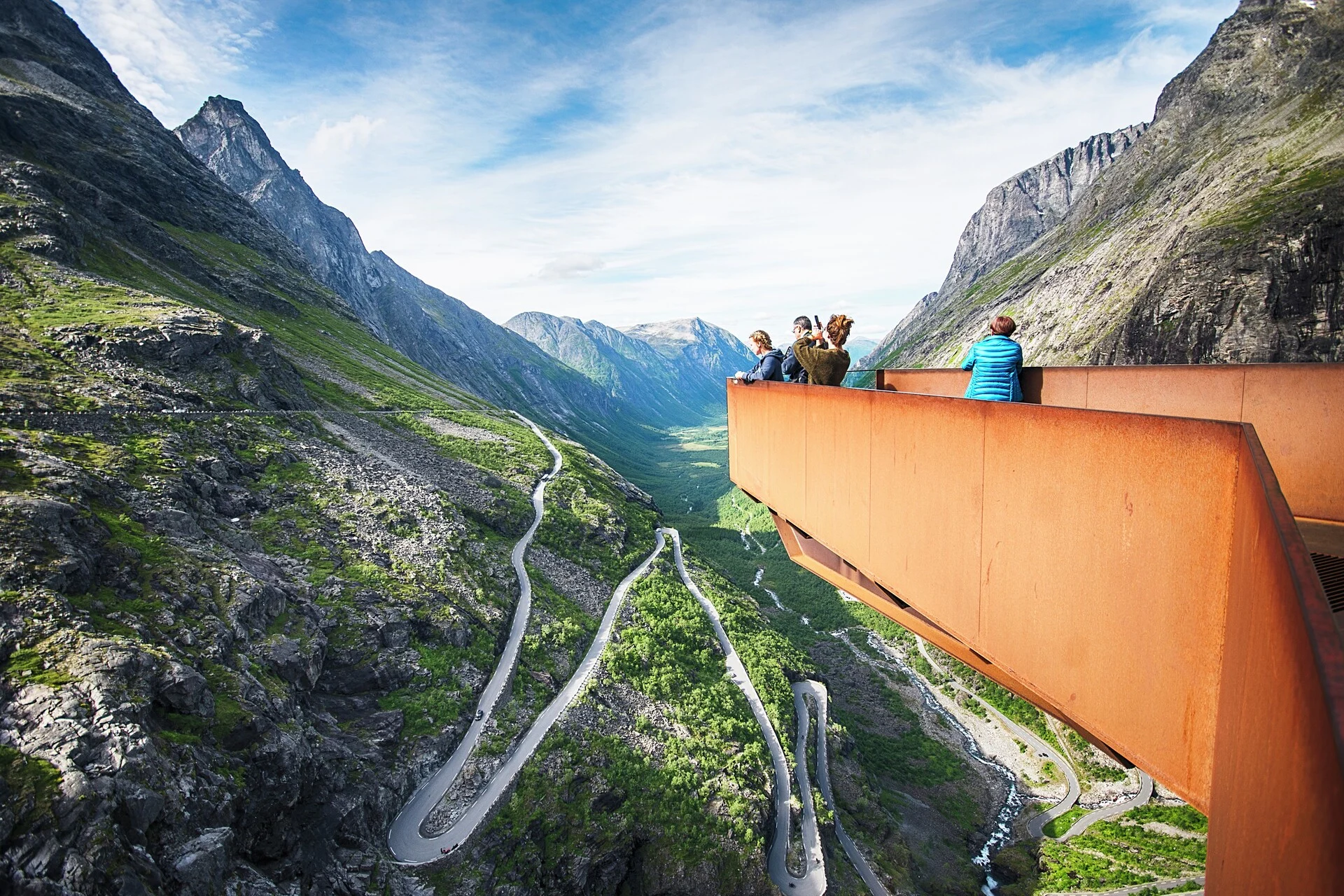 A group of tourists look out over Trollstigen in Åndalsnes