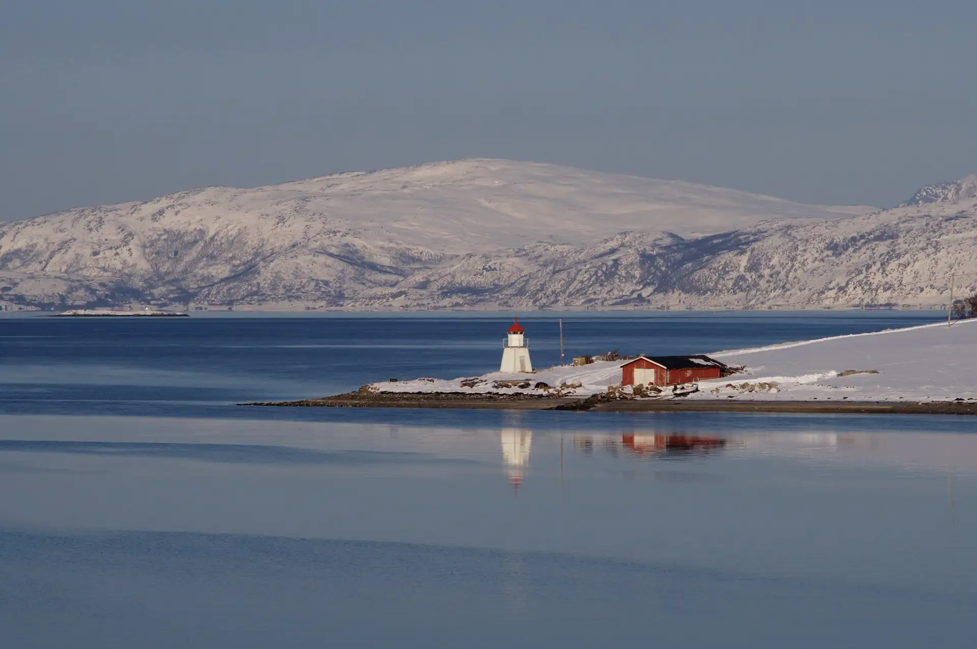 Small lighthouse and rorbu in Kirkenes, Norway