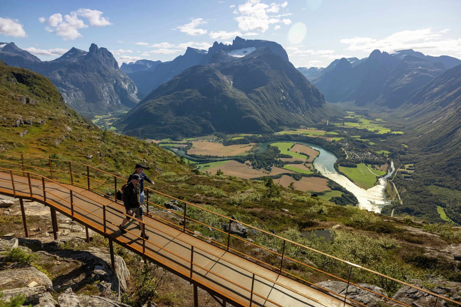 Hiking along the walkway on Nesaksla mountain in Åndalsnes, Norway