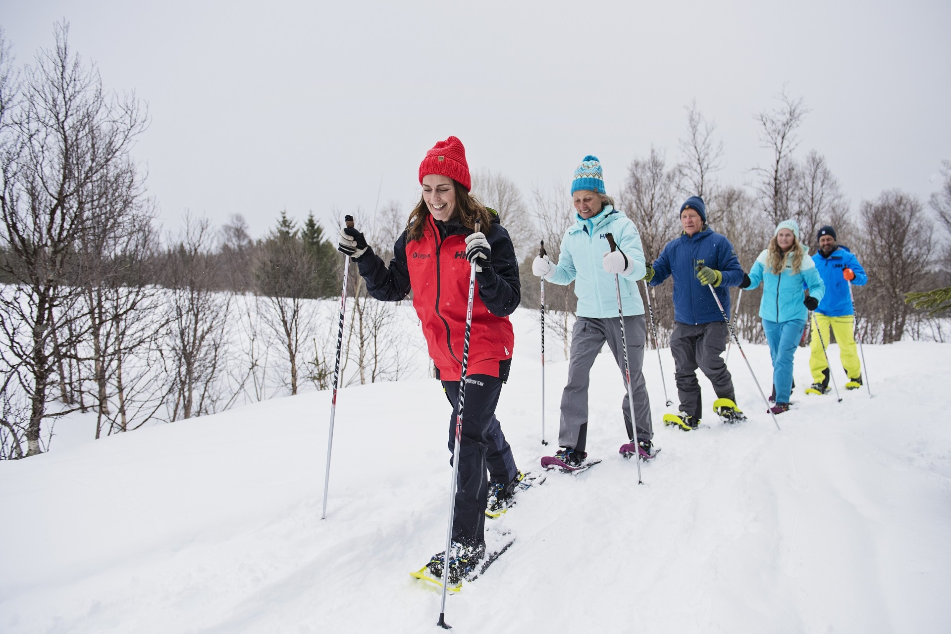 A group of tourists on a snowshoeing tour in Tromso