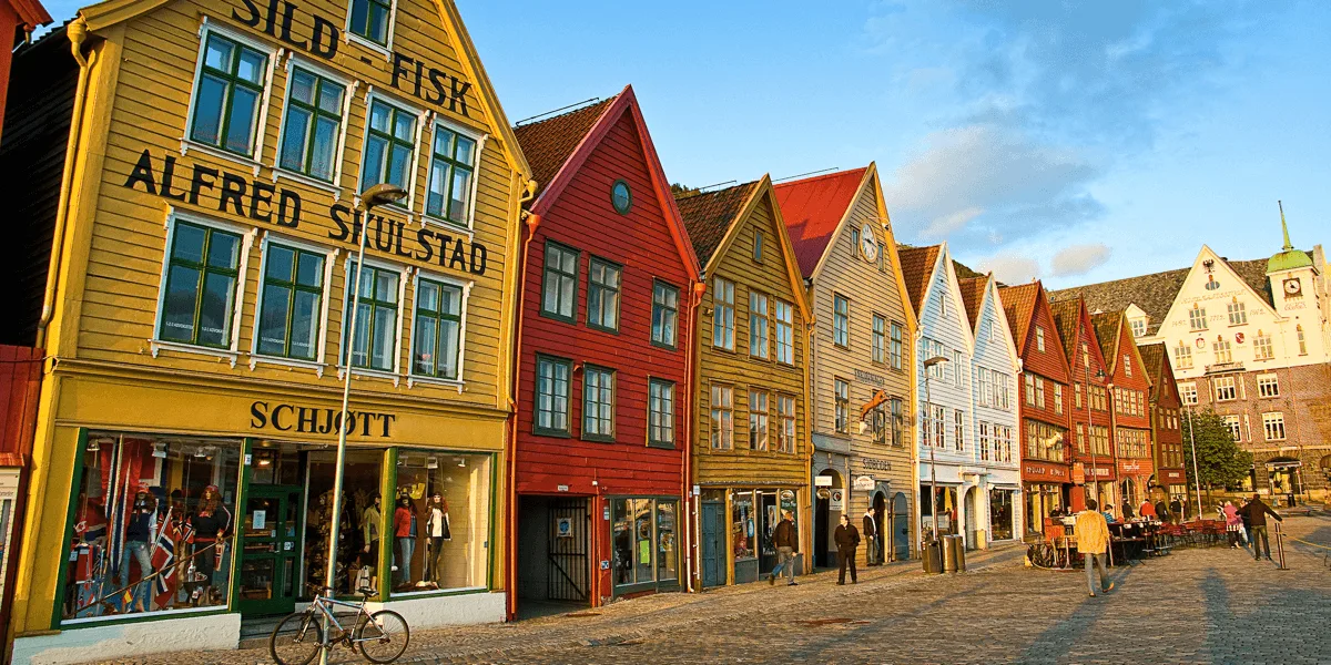 A store in a brick building with Bryggen in the background