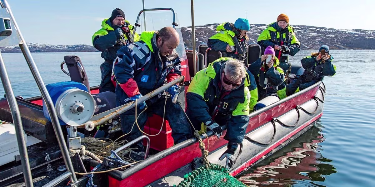 A group of people on a raft in a body of water