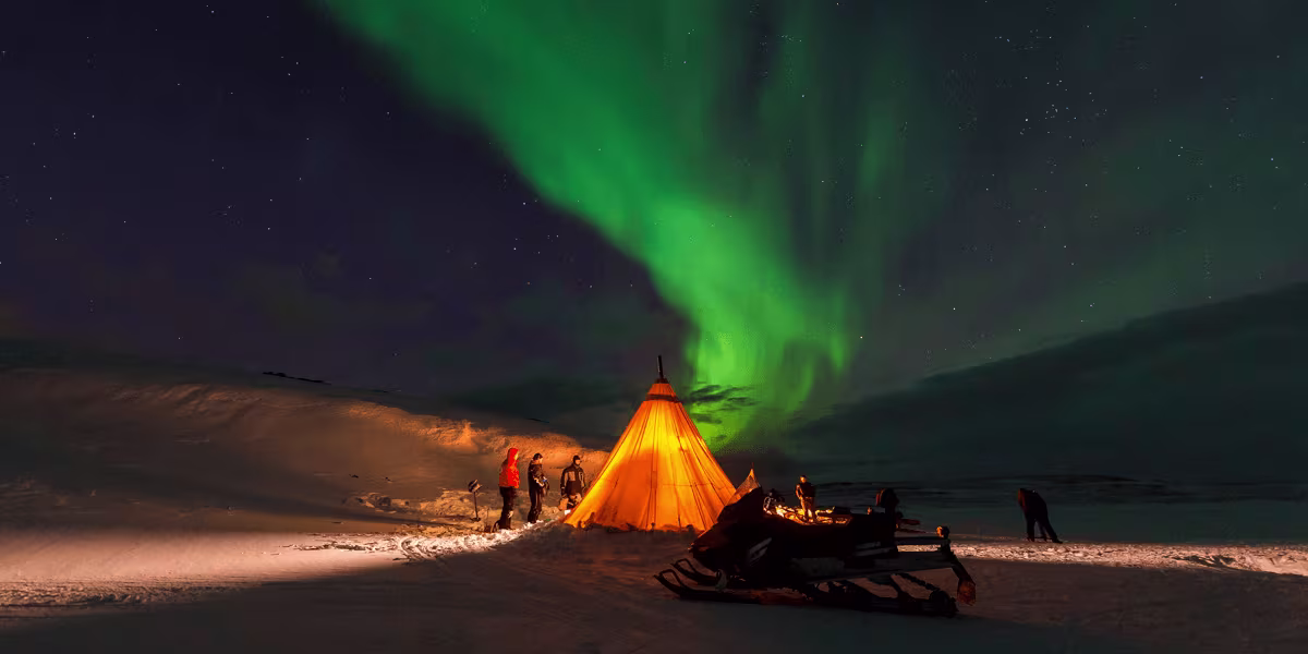 A person with a sunset in the background