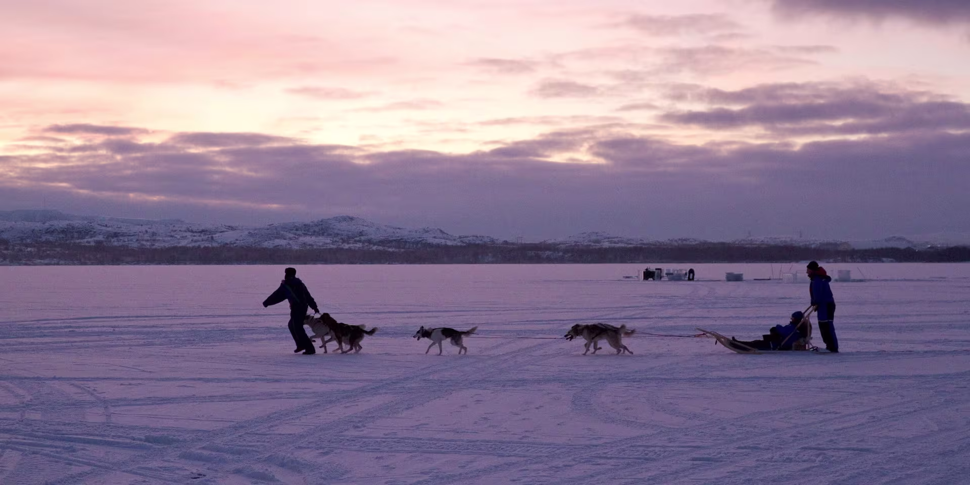 A group of people riding skis on a snowy hill