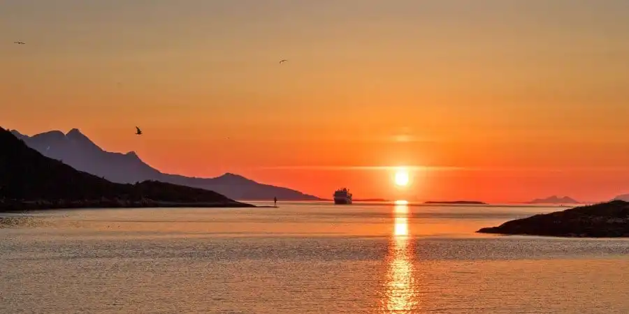 Southbound Hurtigruten in Midnight Sun near Bodø