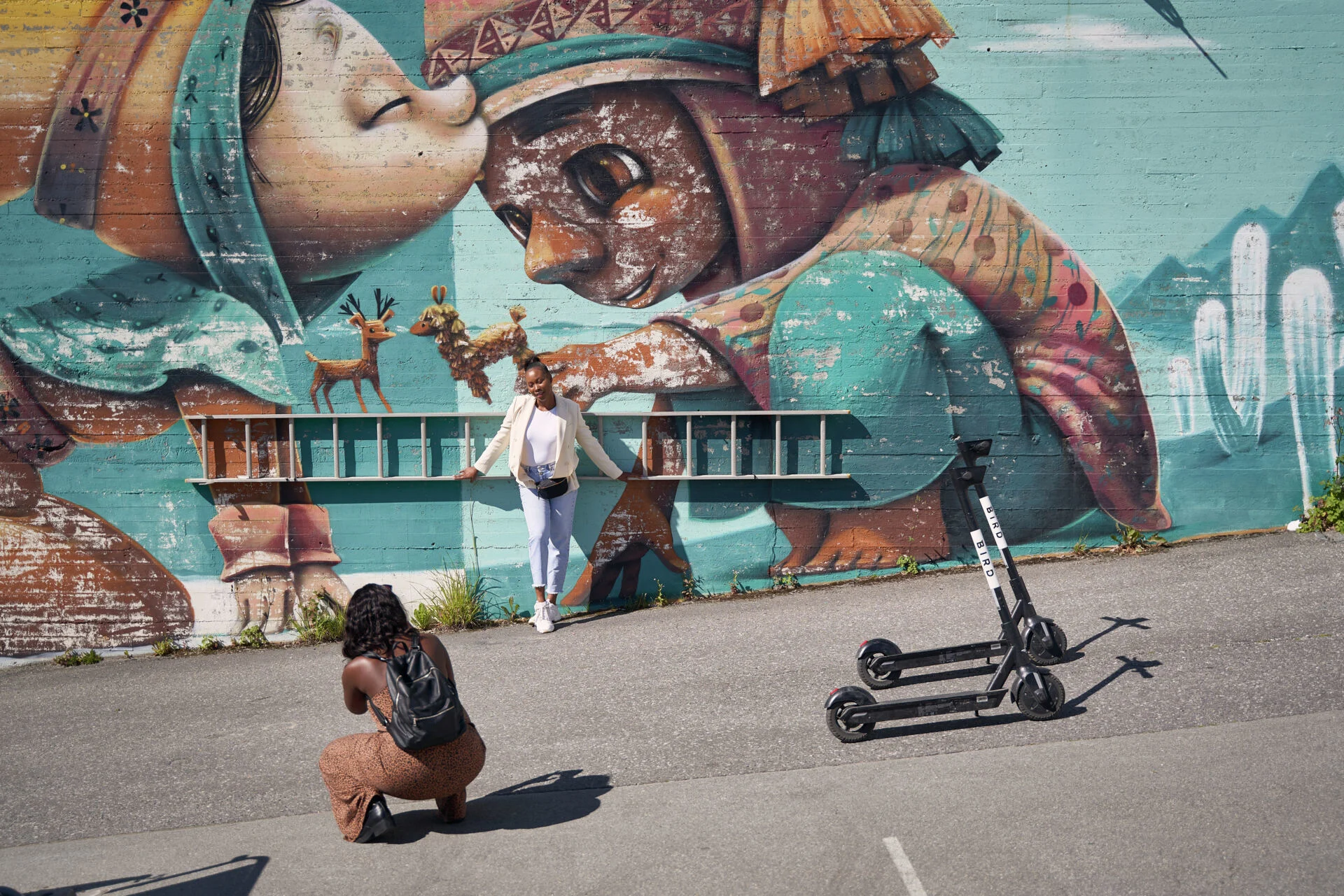 A woman poses outside a street mural in Bodø, the European Capital of Culture for 2024. Photo by: Raymond Engmark