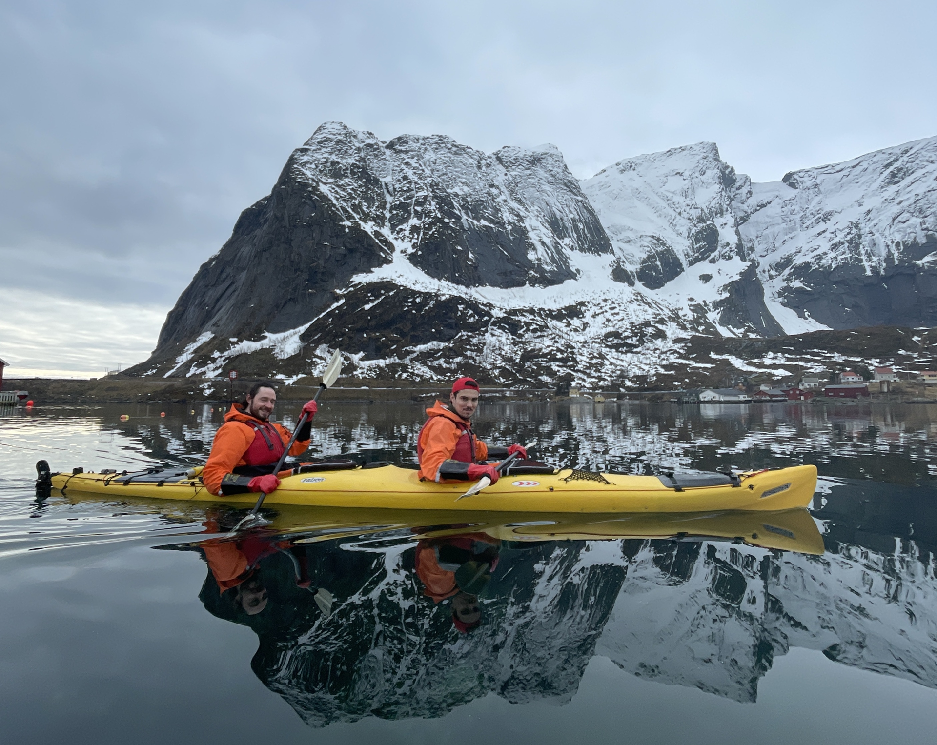 people-yellow-kayak-snow-fjords-water-reflection