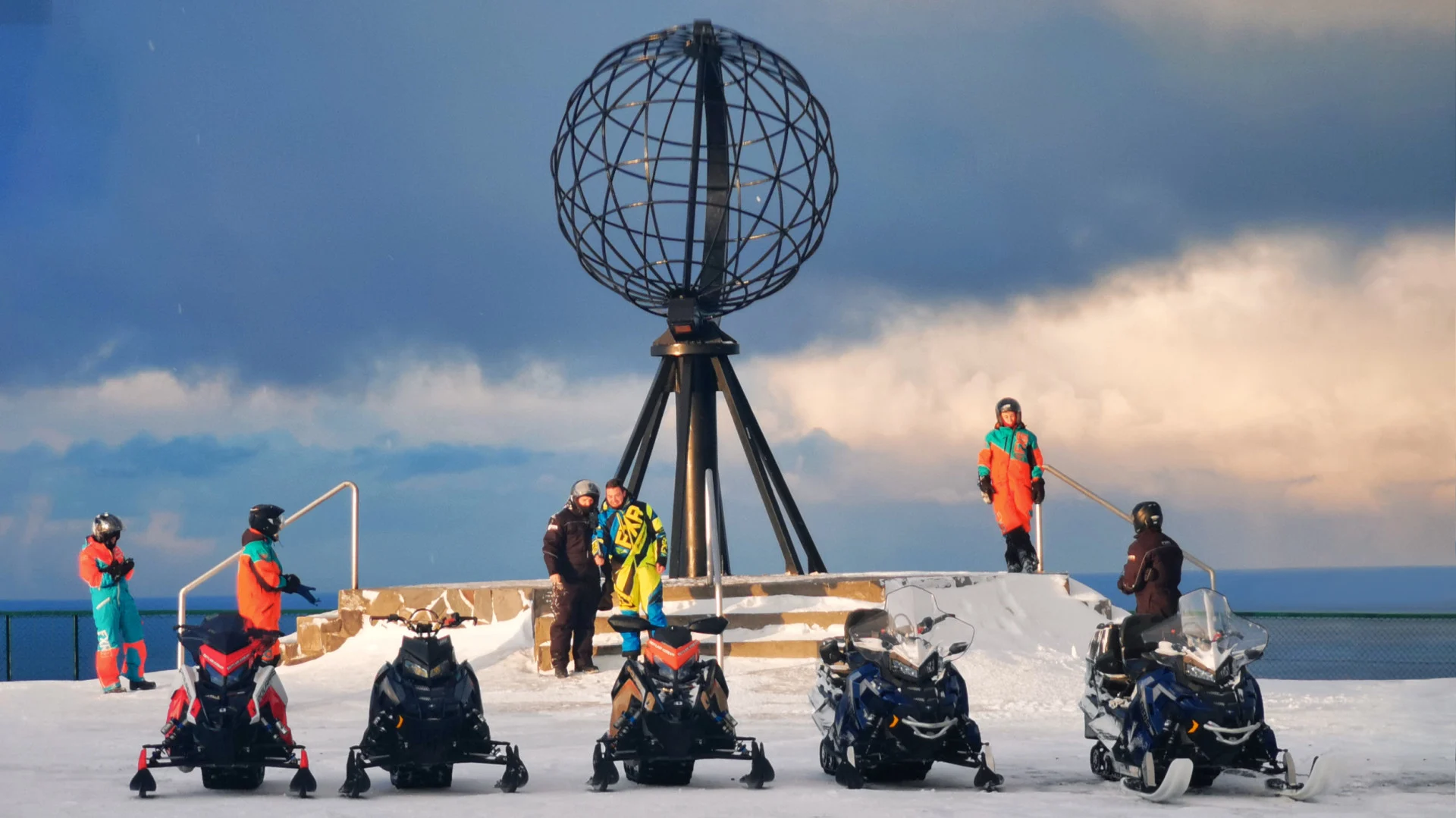 A group of tourist snowmobiling to the North Cape