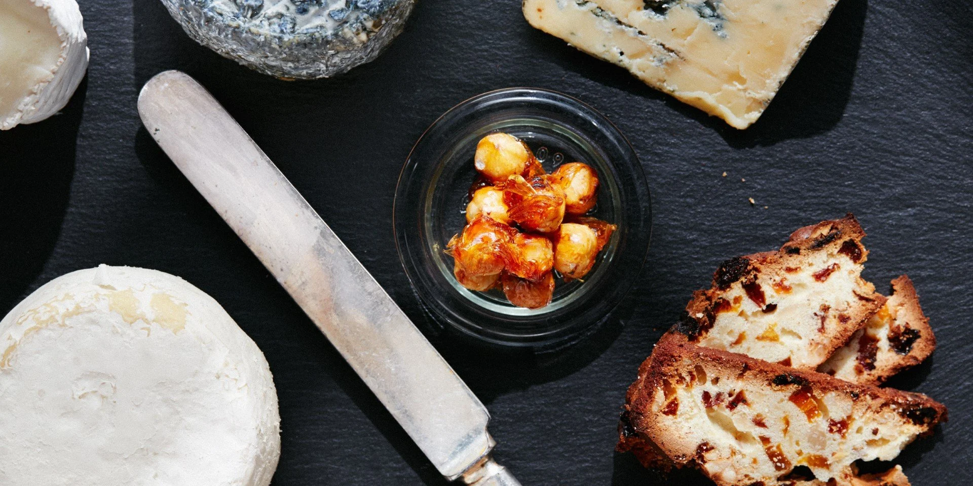 Cheese, caramelized hazelnuts, fruit and nut bread