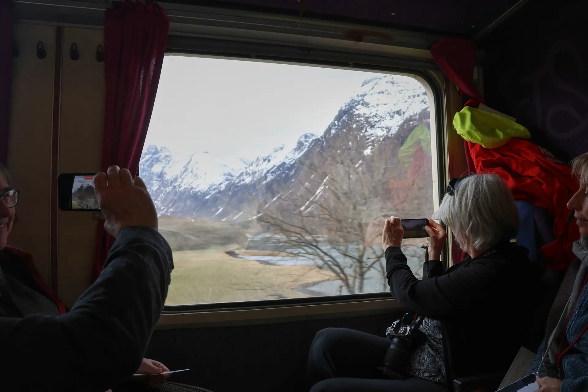 golden-train-passenger-captures-romsdal-valley-alps-andalsnes-mobile-device