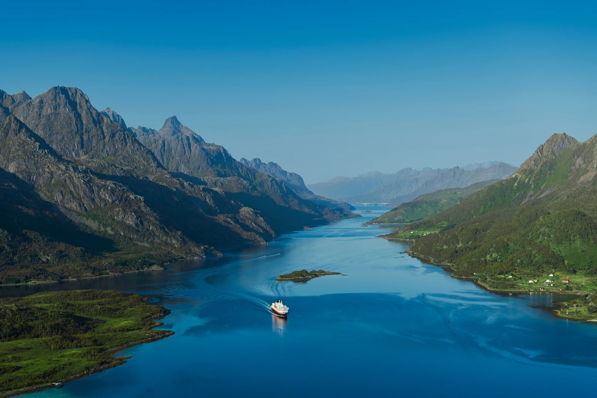 MS Kong Harald passing through the Raftsundet Strait in northern Norway