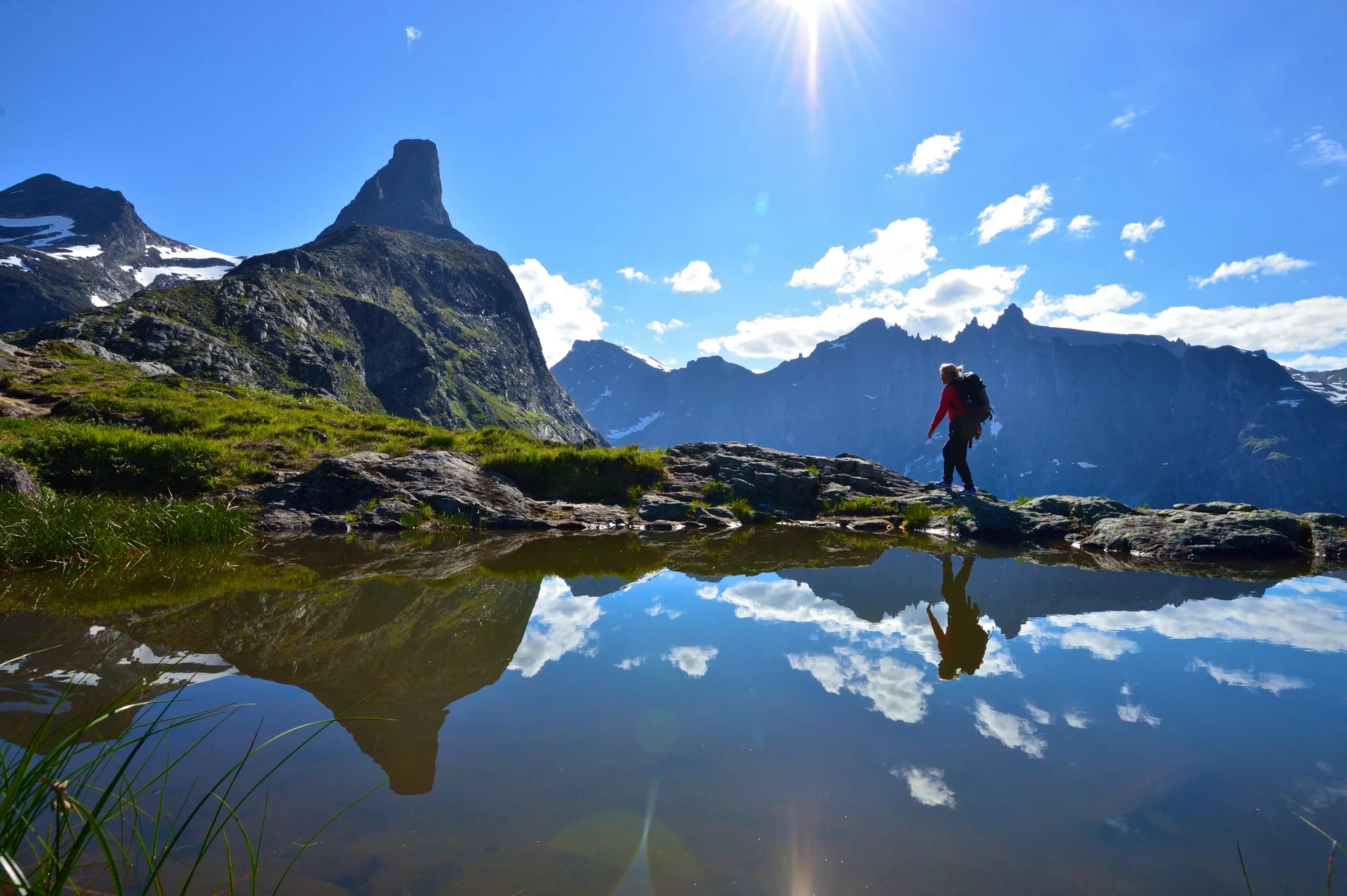 A woman hiking up to Litlefjellet mountain in Åndalsnes, Norway. Image copyright: Øyvind Heen - fjords.com