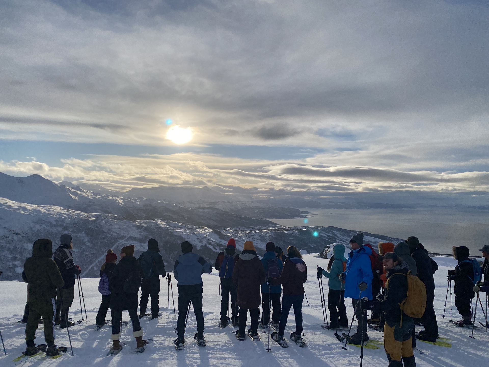 group-people-snowshoes-snow-mountain-looking-aky