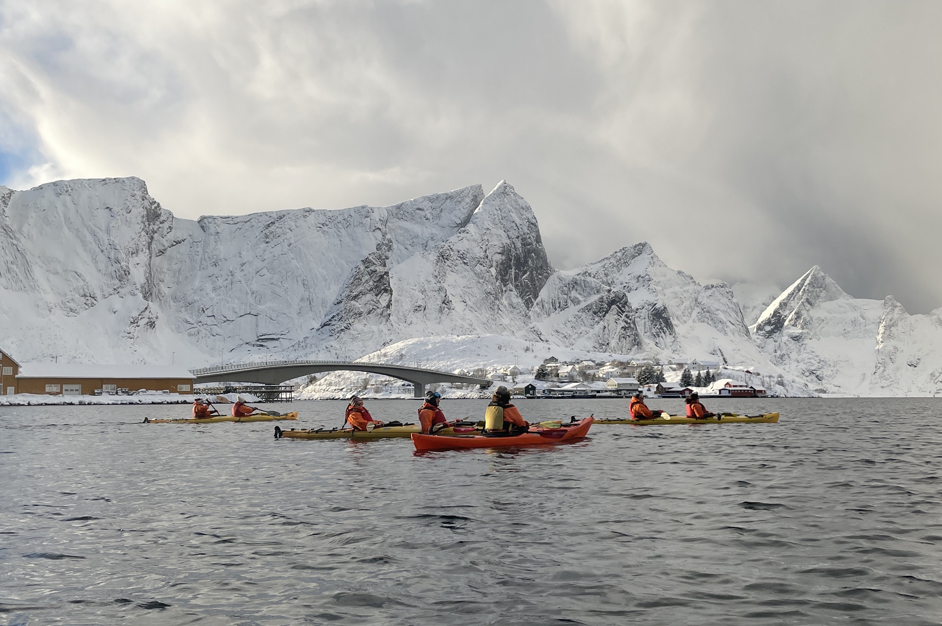 people-red-kayaks-snow-fjords