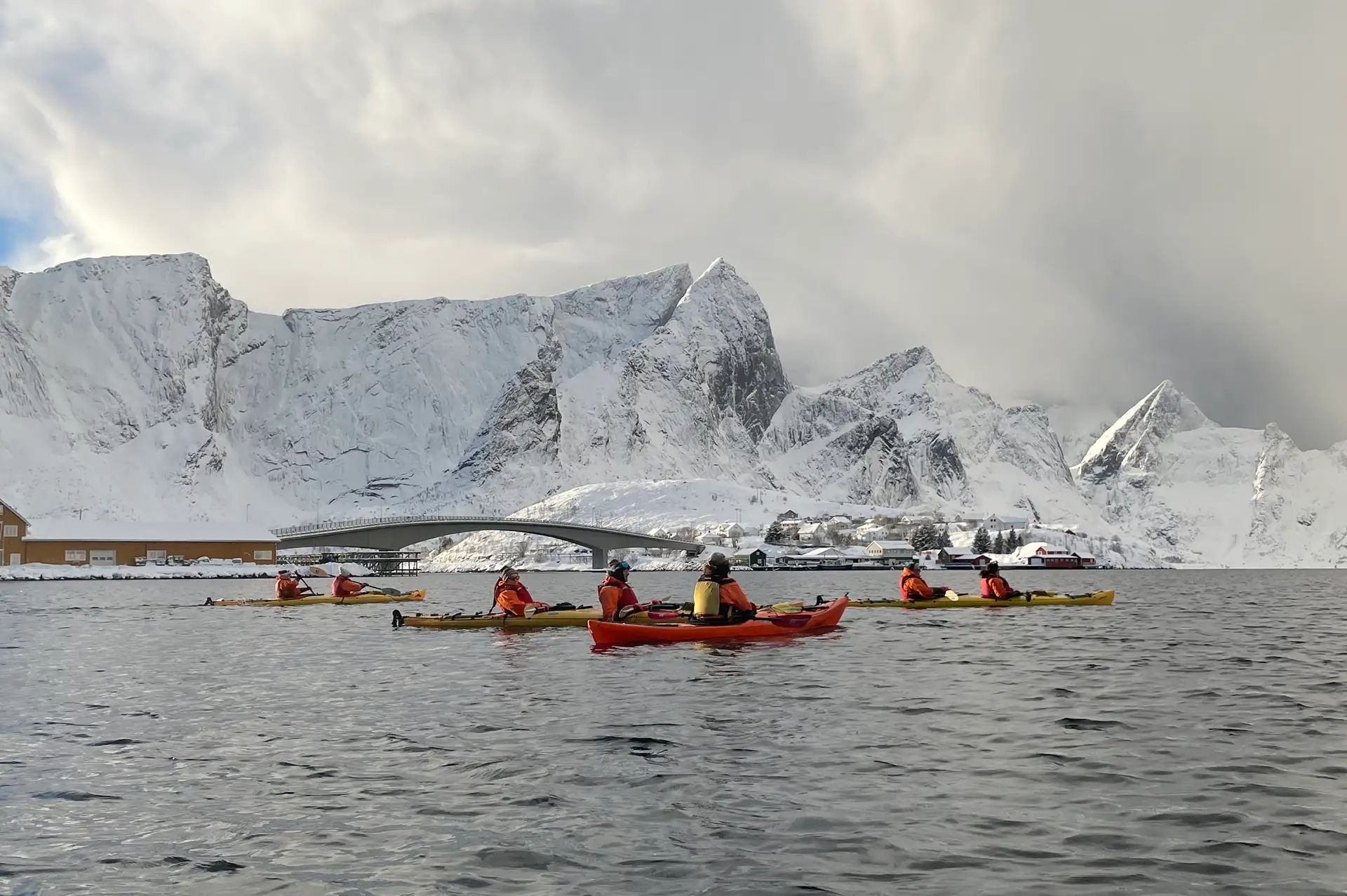 people-red-kayaks-snow-fjords