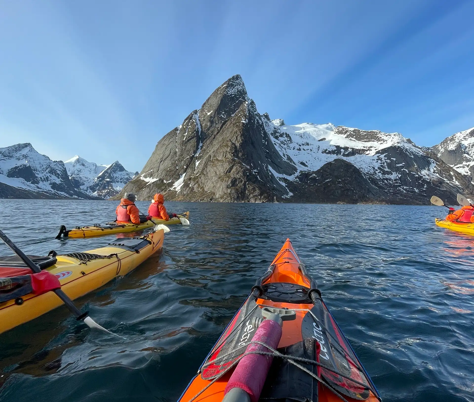 people-kayak-water-snow-fjords-blue-sky
