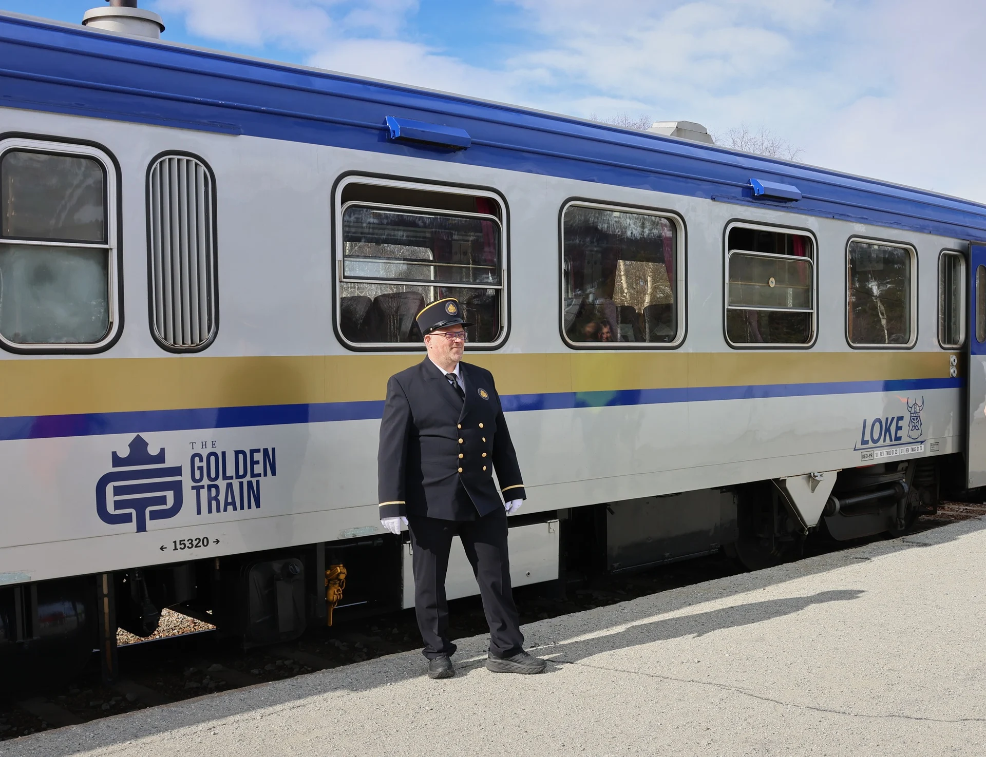 conductor-of-golden-train-standing-by-train-norway-1920