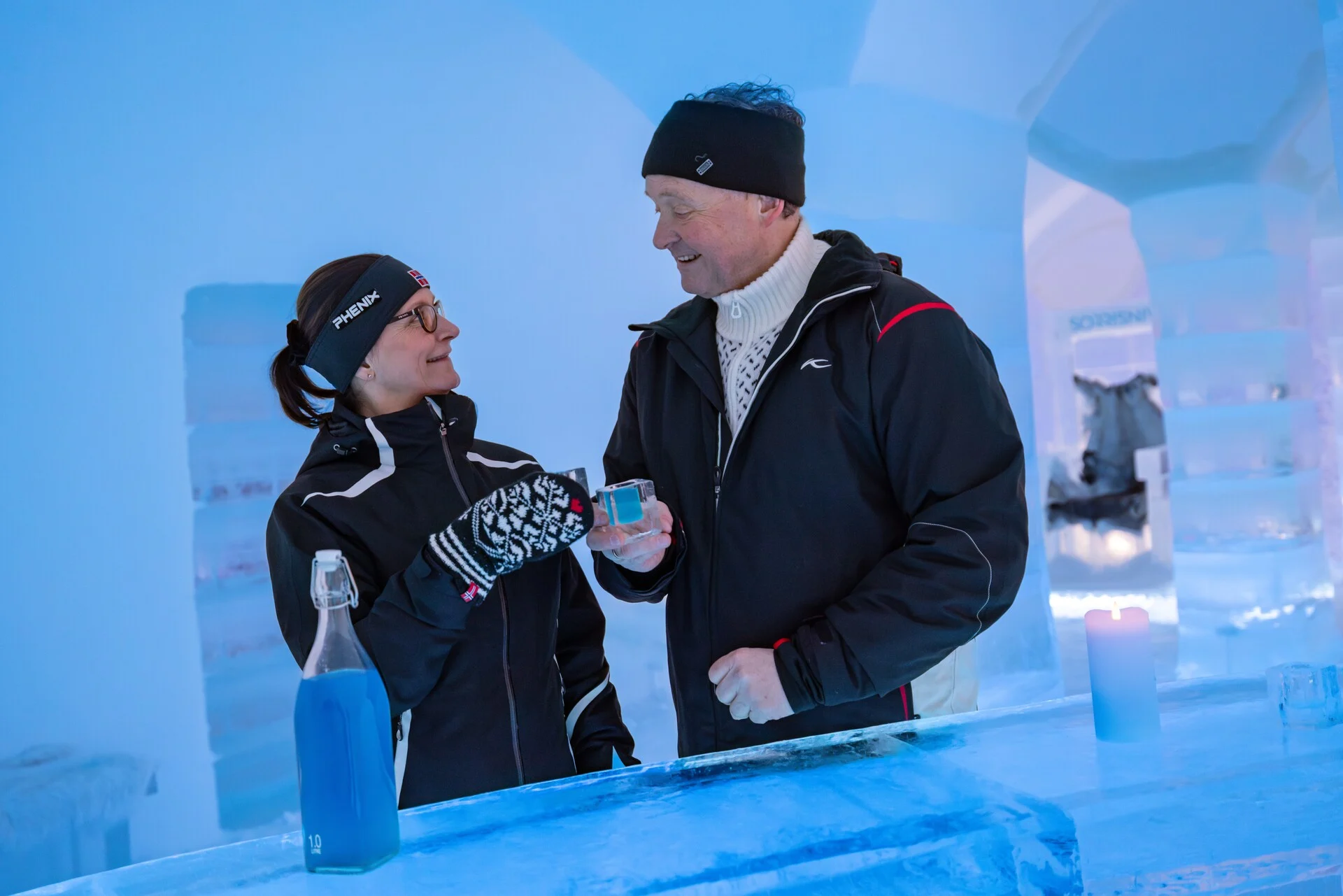 A couple enjoying a drink at the Sorrisniva Ice Hotel, Norway