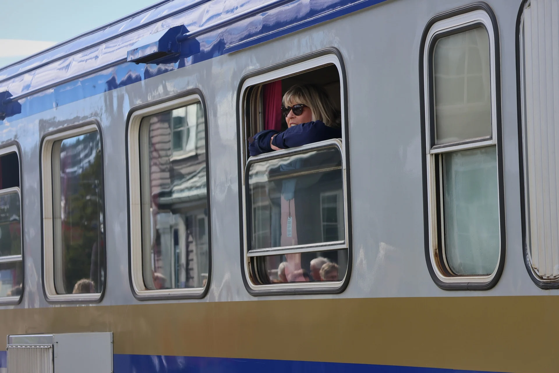 passenger-golden-train-looking-out-window-1920