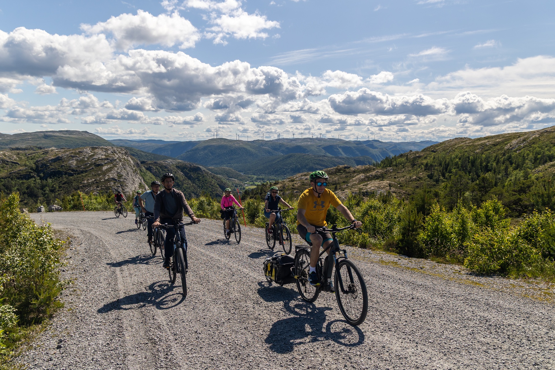 bessaker-people-electric-bicycles-helmets-gravel-road-fjords-m-afflerbach