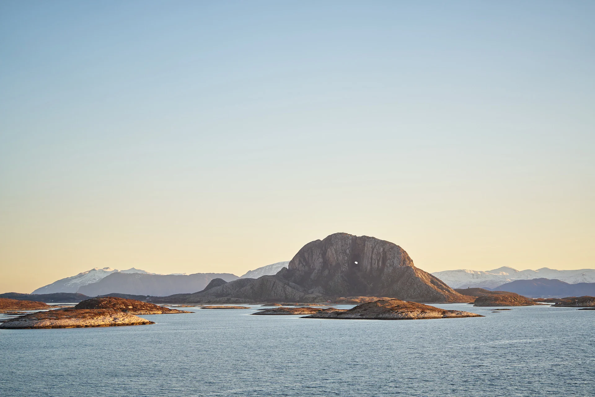 Torghatten, the legendary mountain with a hole through its centre, rising from the Helgeland coast