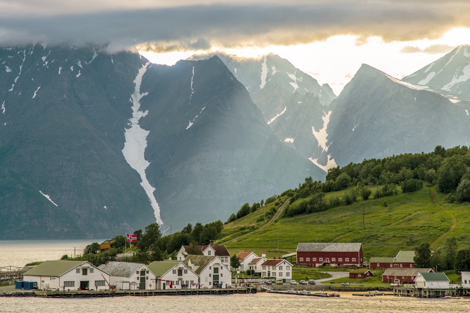 Sunlight breaking through clouds over Skjervoy, Norway