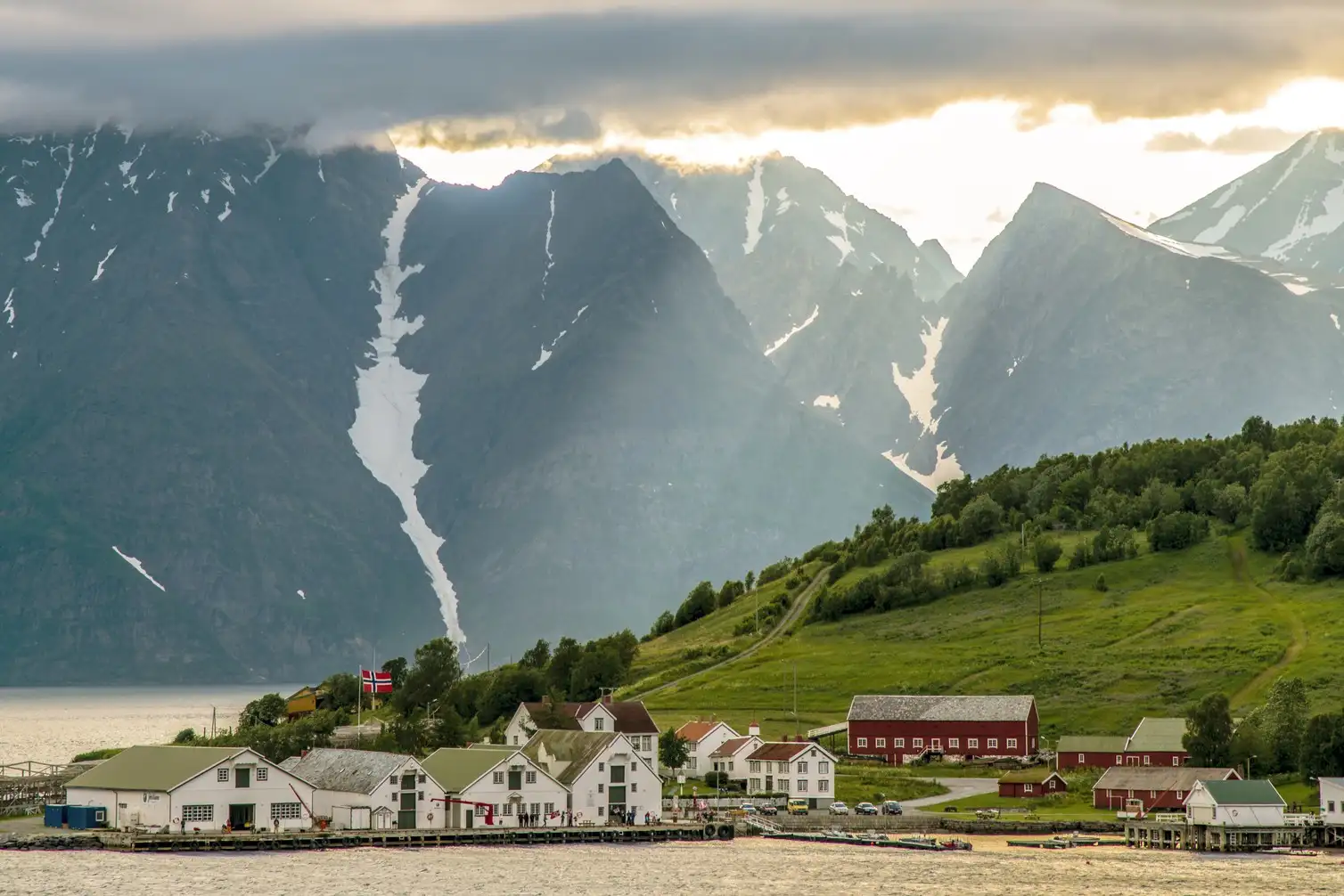 Sunlight breaking through clouds over Skjervoy, Norway