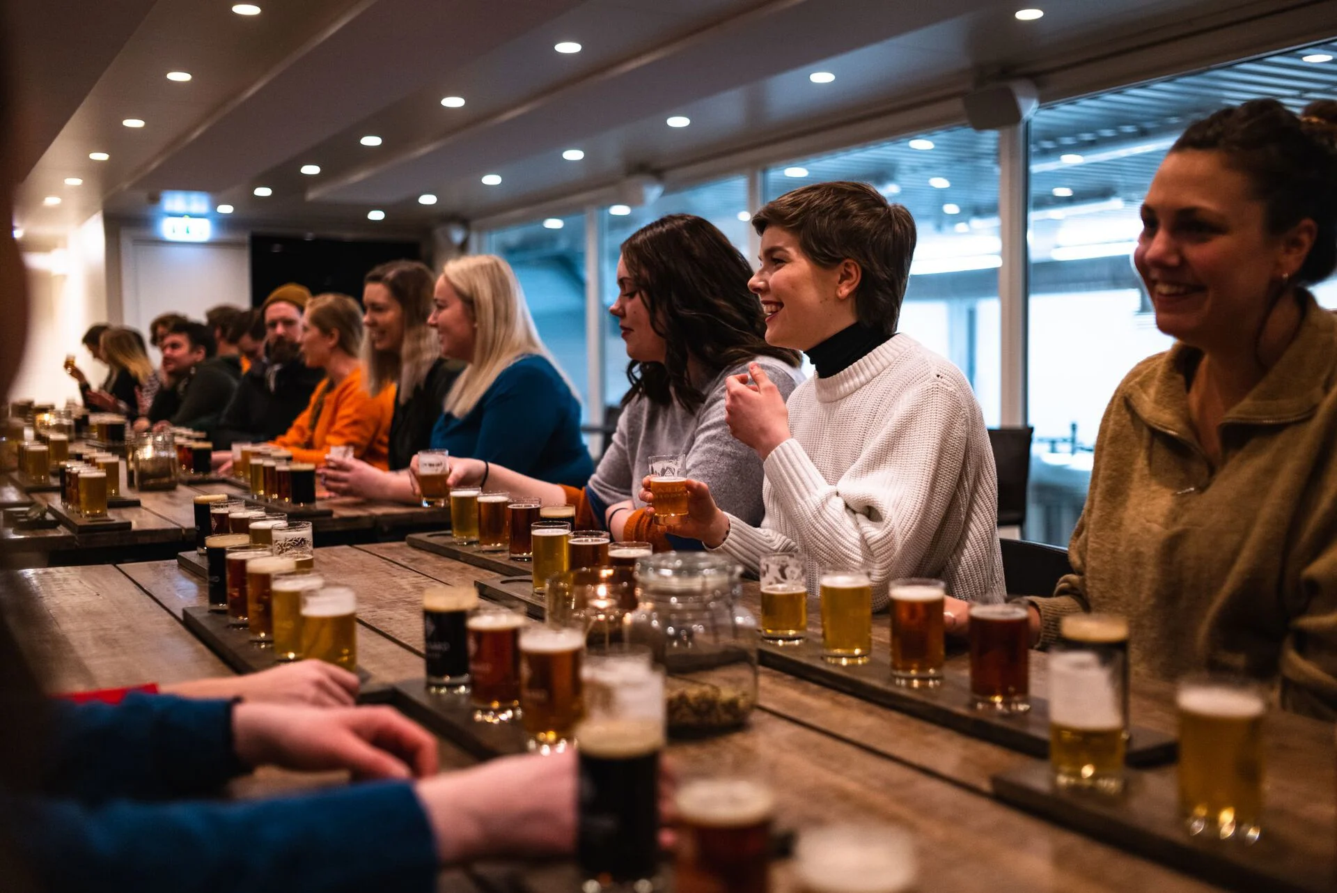 Friends tasting beer at the Svalbard Bryggeri in Longyearbyen, the world's northernmost brewery