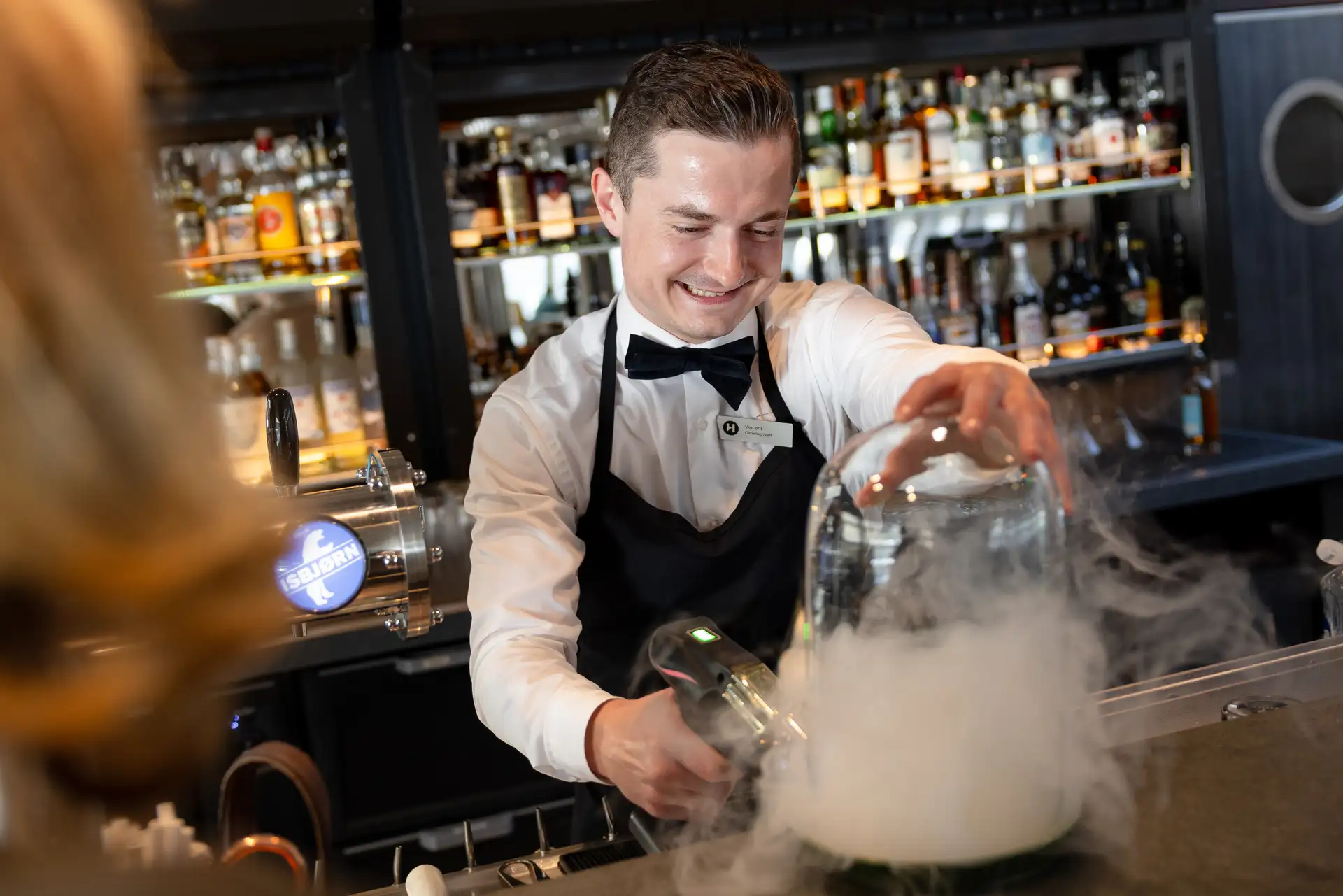 Bartender making a cocktail in 1893 Bar on MS Finnmarken