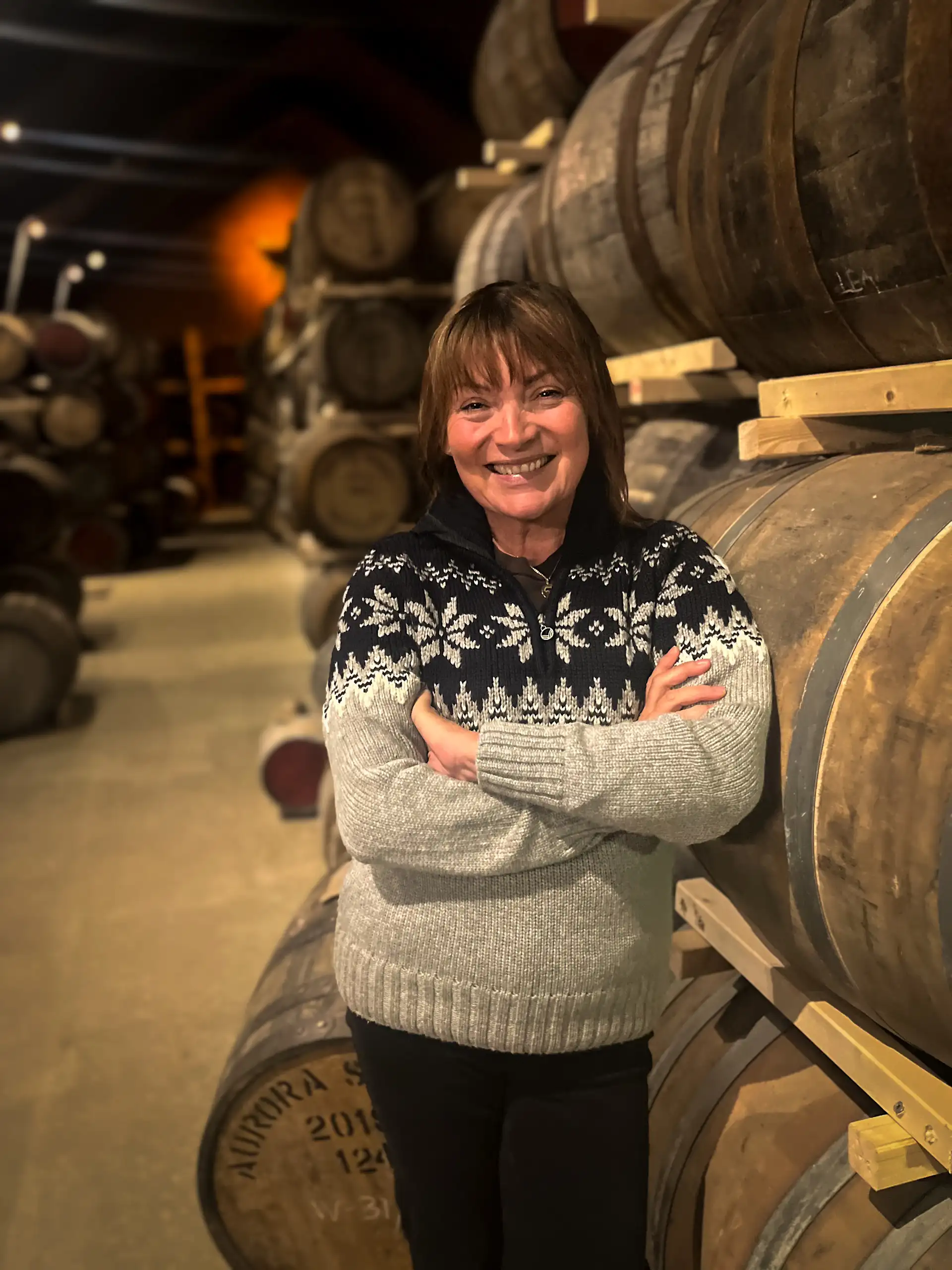 Lorraine Kelly tasting whisky at the world's northernmost distillery while filming Lorraine Kelly's Norwegian Odyssey