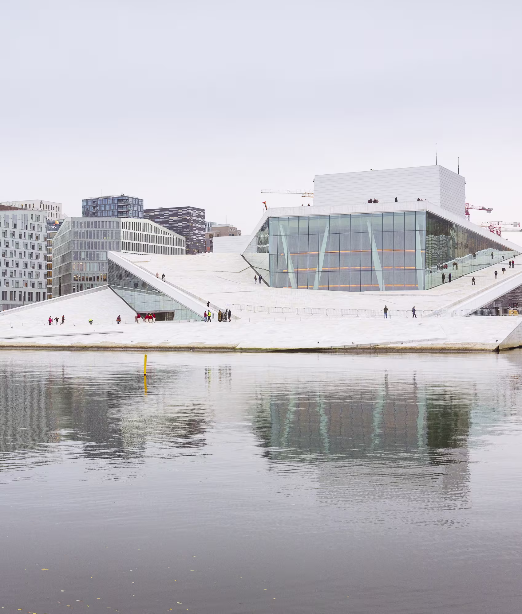 A boat is docked next to a body of water