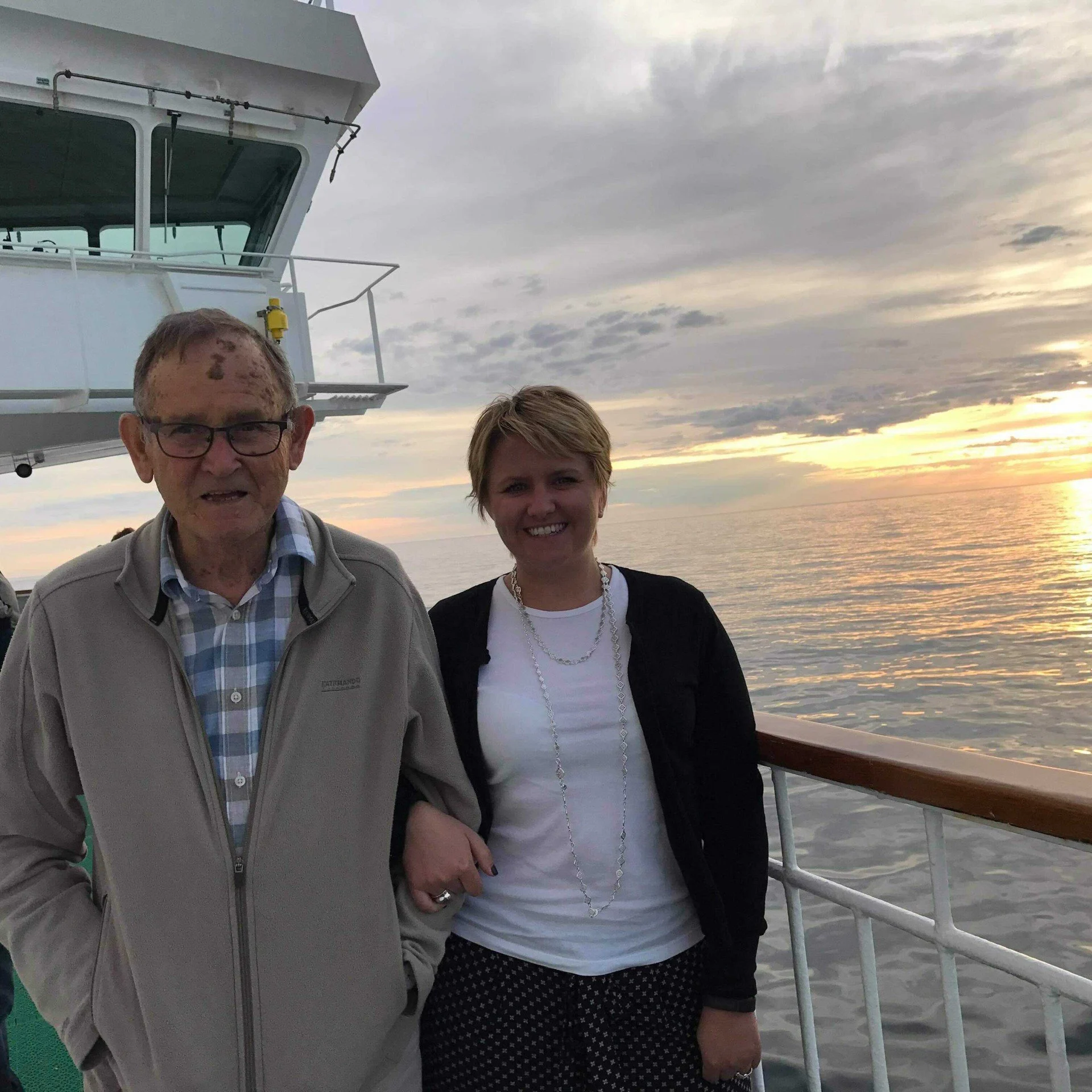 Bronwen Pyle on a midnight sun cruise with her father - both standing on deck