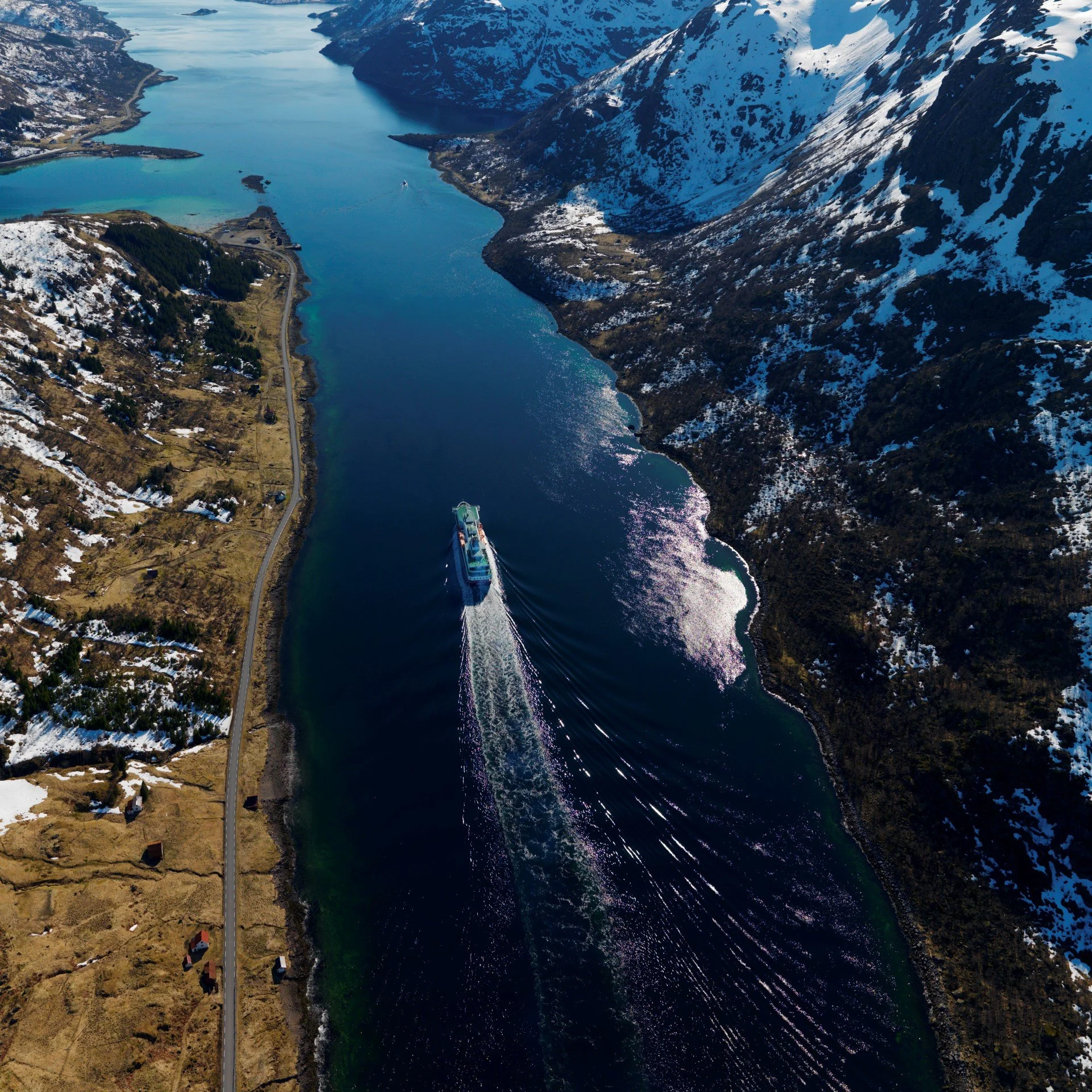 MS Richard With, the ship named after the founder of Hurtigruten, is sailing in "Raftsundet" on a clear, blue sky, winterday