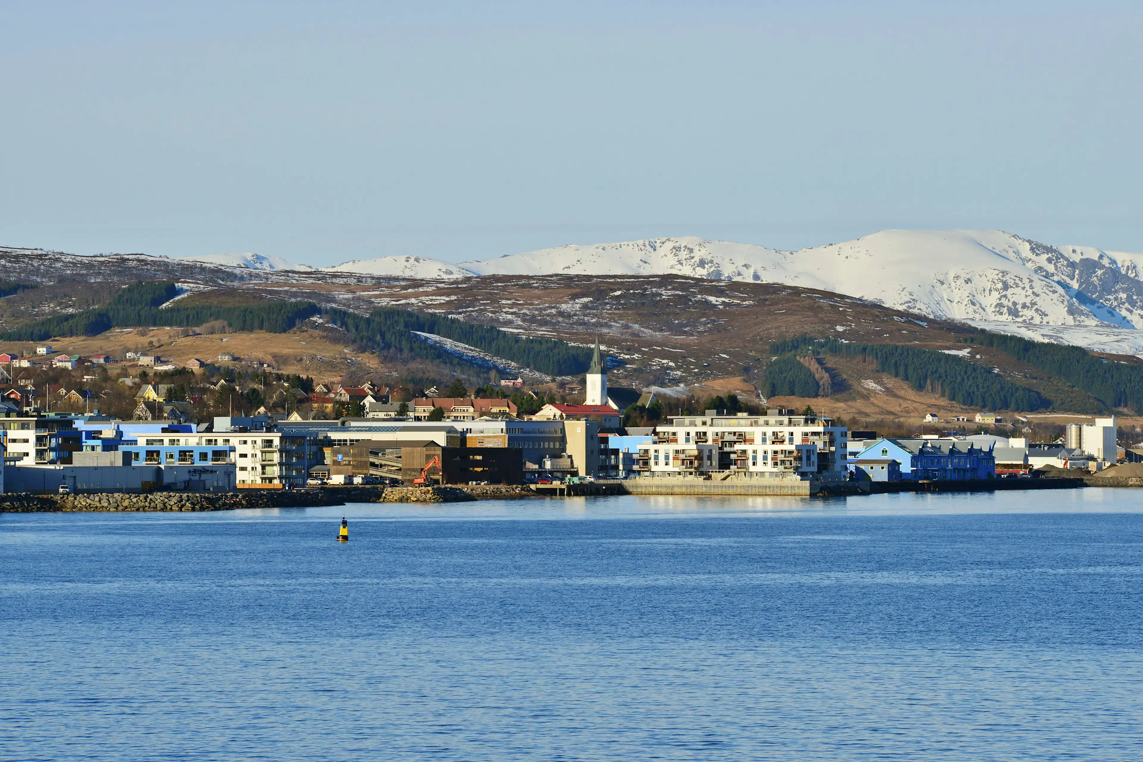 Blue building of Sortland from the sea