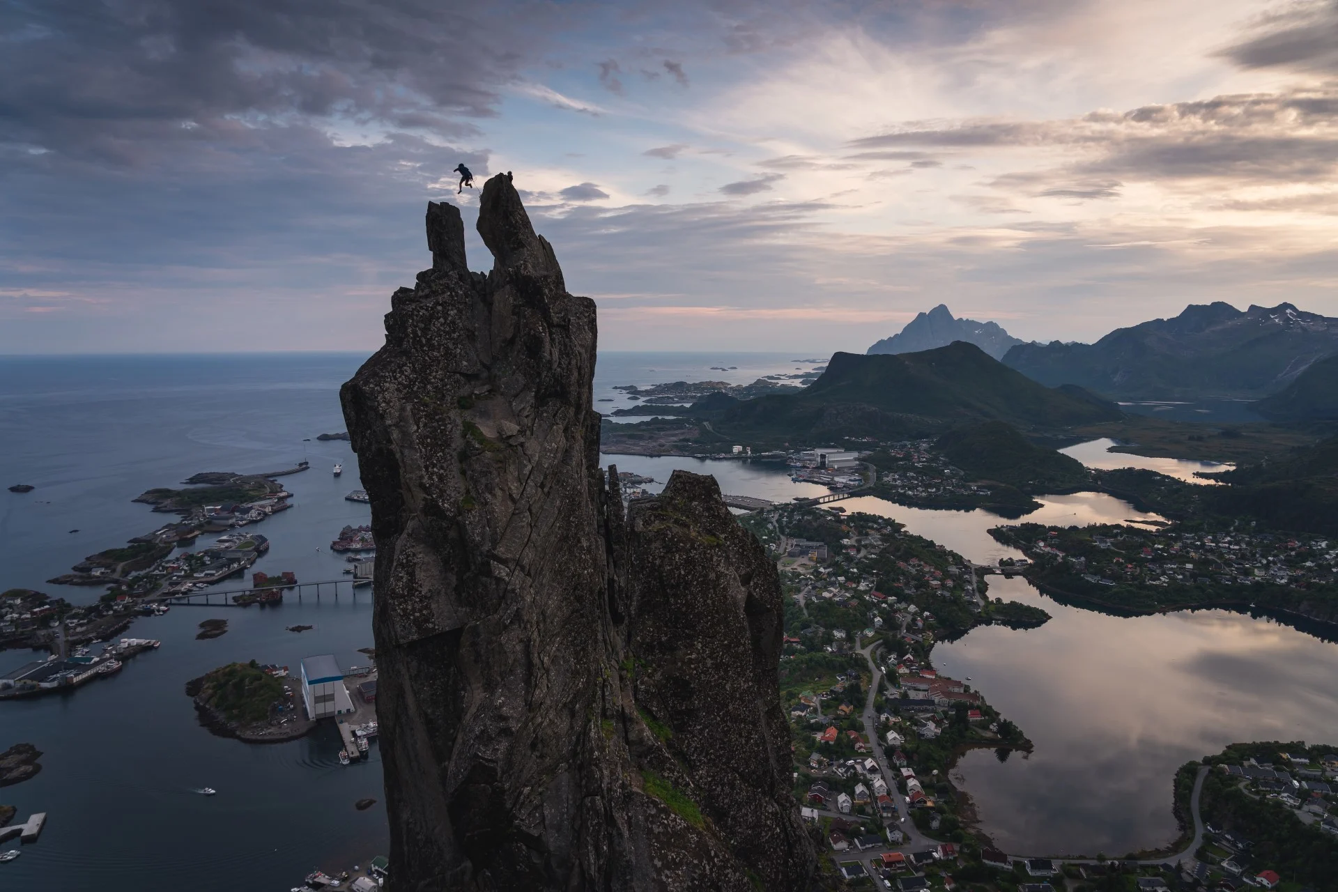 The iconic Svolværgeita - two rock formations shaped like goat horns - looms over Svolvær