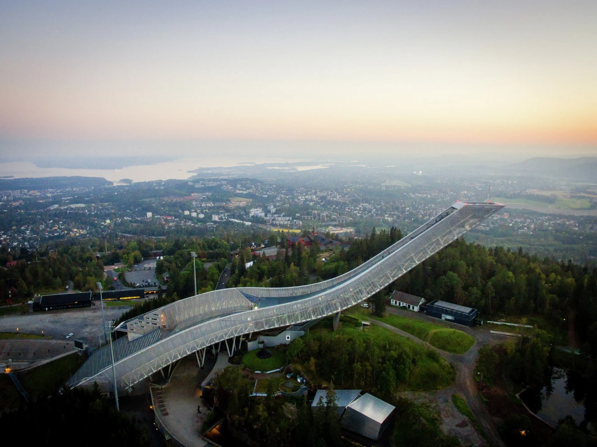 The Holmenkollen ski jump in with the Oslo skyline in the background, Norway.