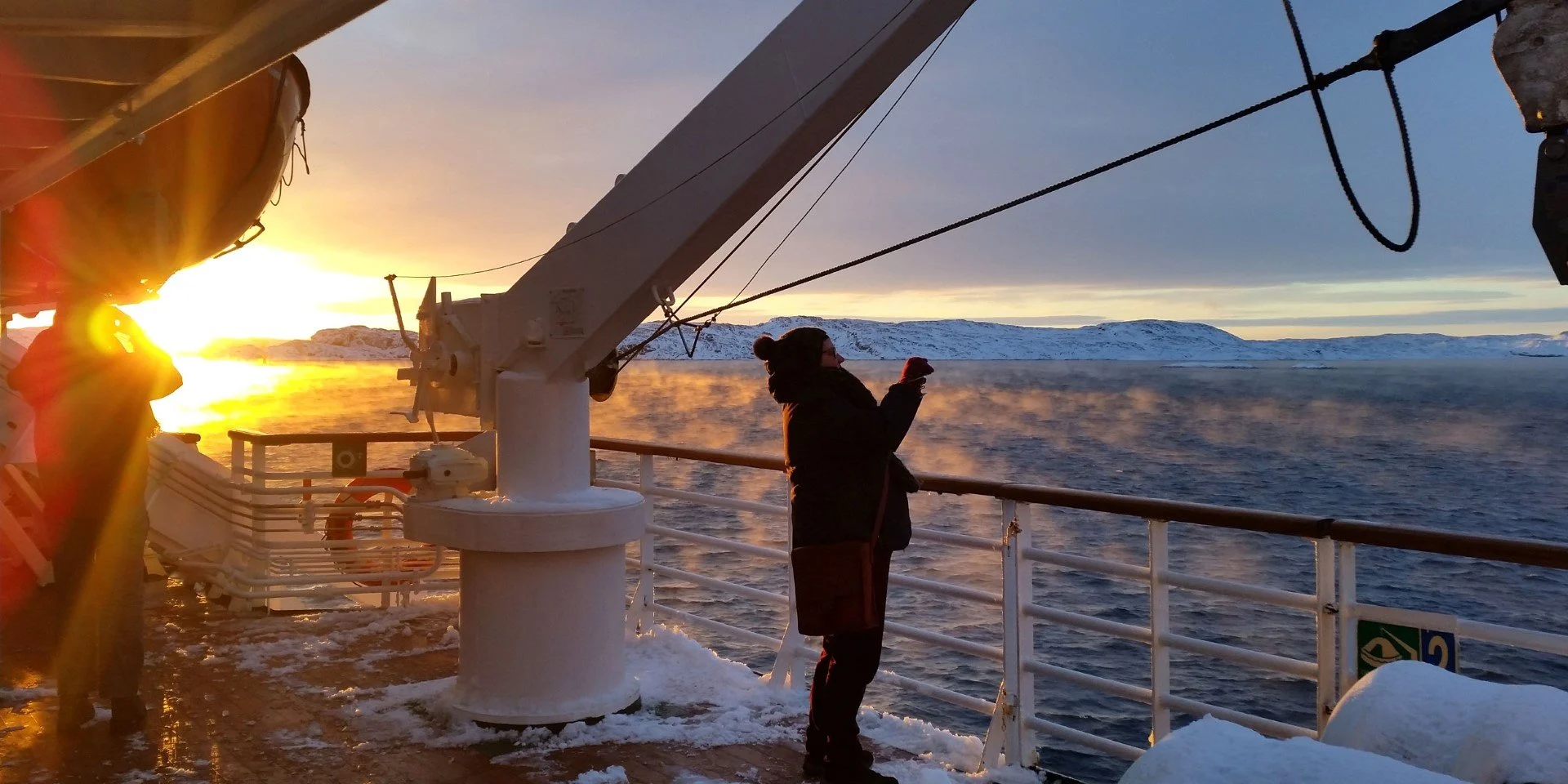 Frosty smoke and a beautiful sunrise. On board MS Vesterålen.