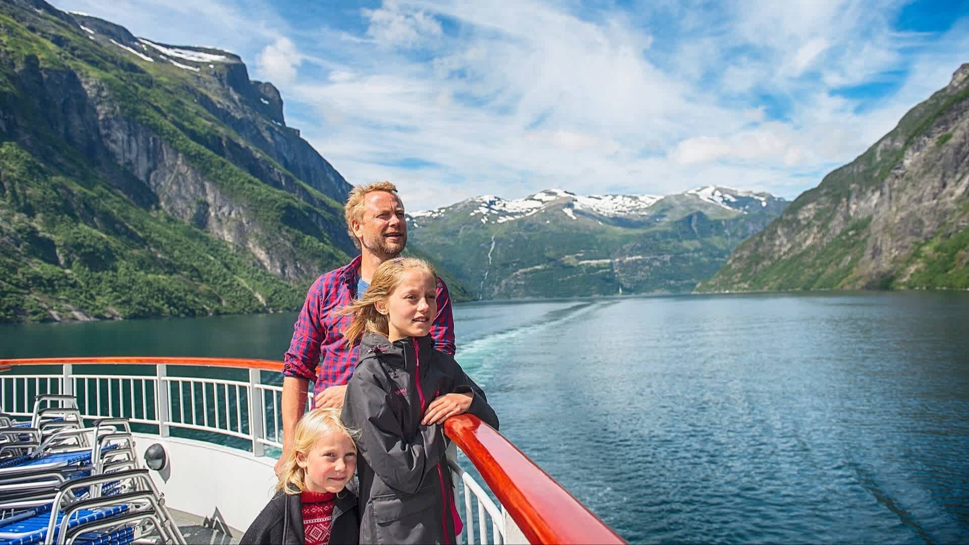 Family admiring the Geirangerfjord