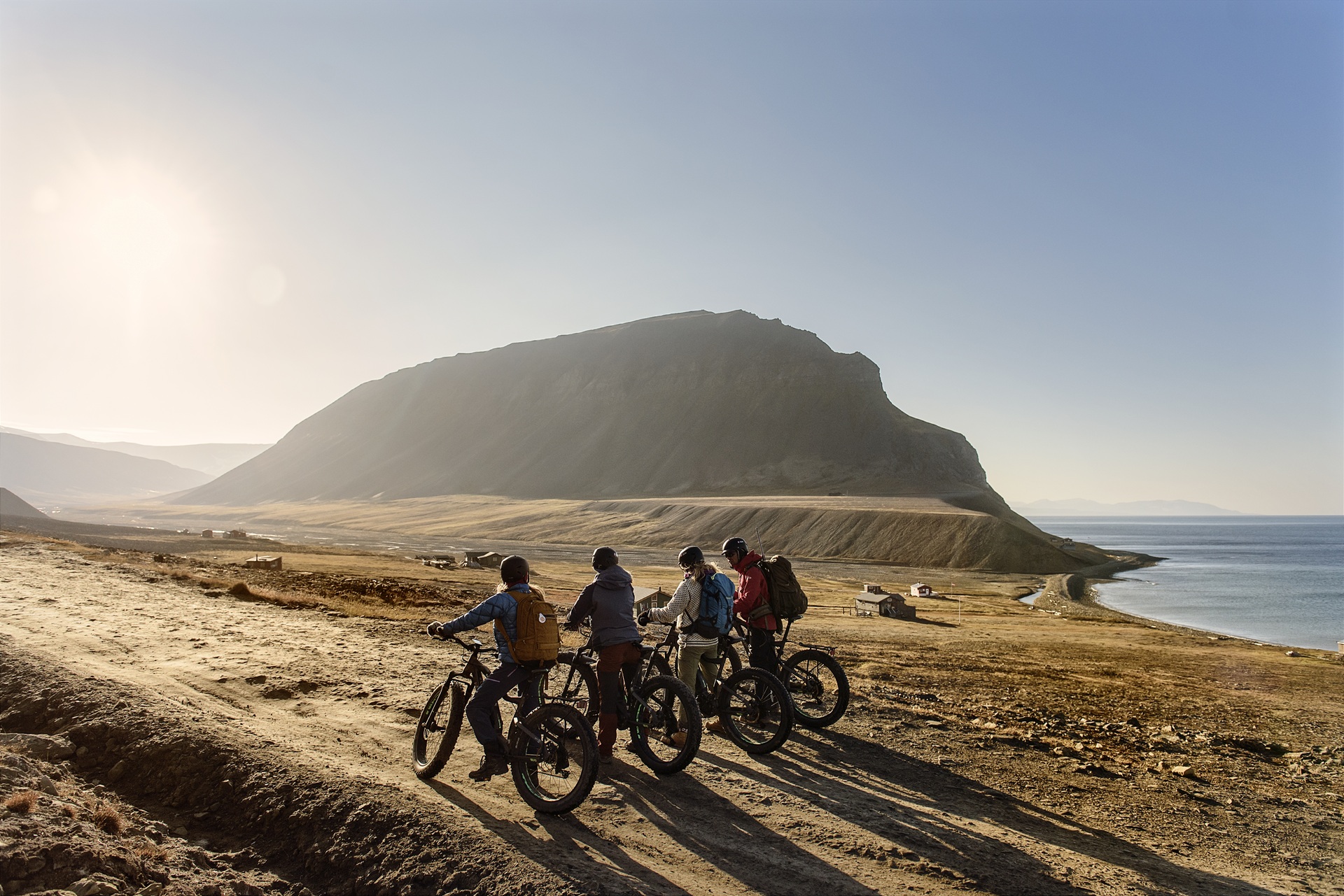 people-electric-bikes-shadows-longyearbyen-svalbard-norway-agurtxane-concellon
