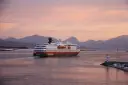 A Hurtigruten ship leaves the ferry terminal in Bergen