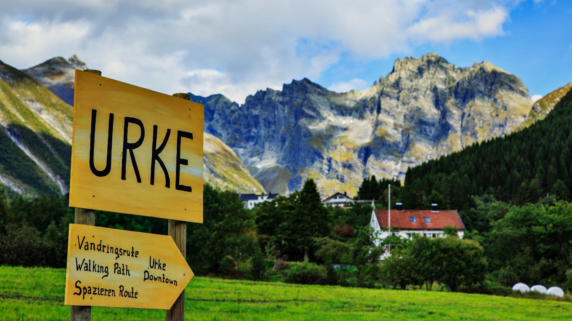 A sign pointing to the village of Urke in the Hjørundfjord, Norway