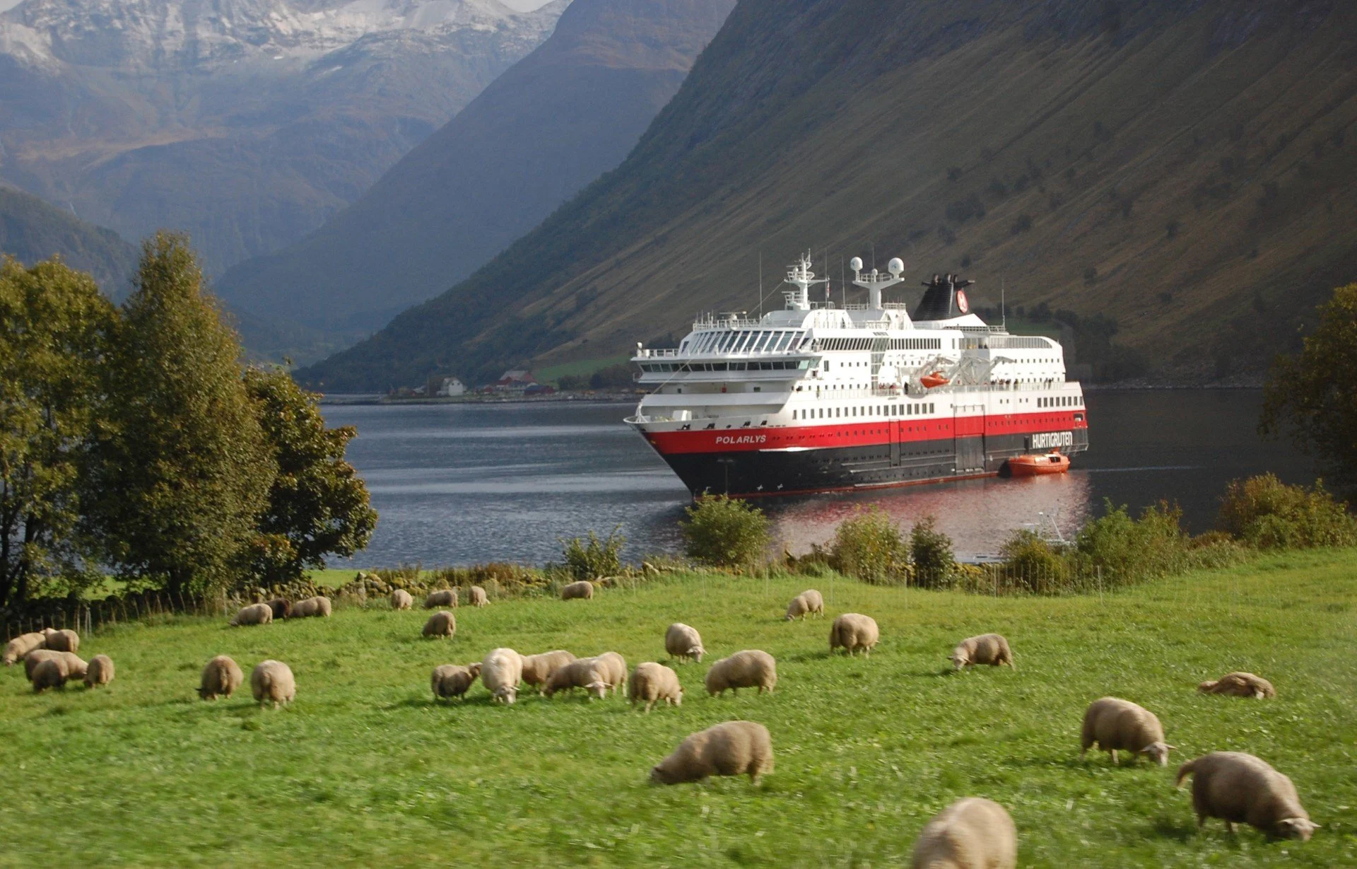 Hurtigruten ship MS Polarlys inside the Norangs Fjord.