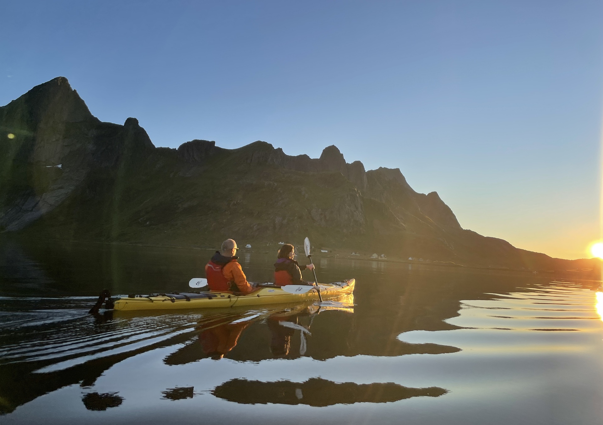 people-yellow-kayak-fjords-water-sun-horizon-reflection