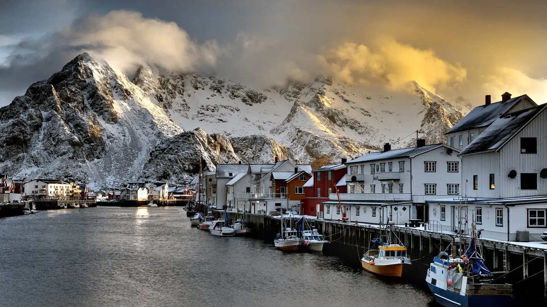 snow-fjords-water-houses-boats-lofoten-norway-shutterstock